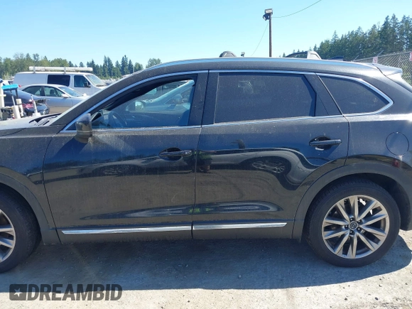 2018 Mazda CX-9 Grand Touring z VIN JM3TCBDY2J0237050, wystawiony jako IAAI lot #42457060 z przebiegiem 130 625 mil mil oraz . Historia ofert i sprzedaży dostępna na DreamBid. Obrazek 14.