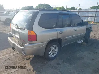 2002 GMC Envoy SLE z VIN 1GKDS13S122357410, wystawiony jako IAAI lot #42355556 z przebiegiem Nie podano mil oraz . Historia ofert i sprzedaży dostępna na DreamBid. Obrazek 4.
