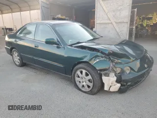 1999 Acura Integra with VIN JH4DB7665XS000928, listed as a Copart auction lot 80924344 with 198,981 mi miles and Salvage title. Bid and sale history available at DreamBid. Image 4.