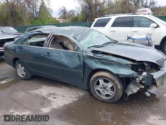 2002 Toyota Camry XLE z VIN 4T1BF32K02U522335, wystawiony jako IAAI lot #42037459 z przebiegiem 214 832 mil mil oraz . Historia ofert i sprzedaży dostępna na DreamBid. Obrazek 13.