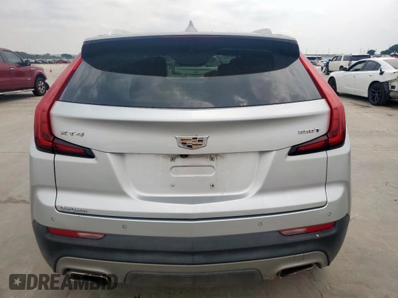 2021 Cadillac XT4 FWD Premium Luxury z VIN 1GYFZCR42MF004233, wystawiony jako Copart lot #57229385 z przebiegiem 98 387 mil mil oraz Szkody całkowita. Historia ofert i sprzedaży dostępna na DreamBid. Obrazek 6.