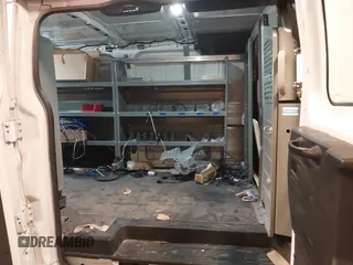 2015 Ford Transit Cargo with VIN 1FTNE1ZM7FKB29711, listed as a IAAI auction lot 41701438 with 169,200 mi miles. Bid and sale history available at carsss.com. Image 8.
