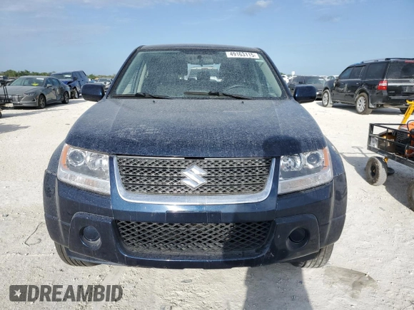 2012 Suzuki Grand Vitara Premium z VIN JS3TD0D29C4100139, wystawiony jako Copart lot #49163115 z przebiegiem 271 080 mil mil oraz Nie do naprawy. Historia ofert i sprzedaży dostępna na DreamBid. Obrazek 5.