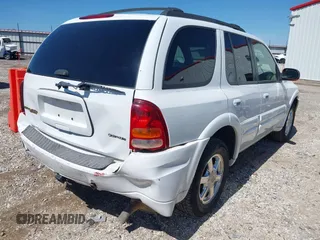 2004 Oldsmobile Bravada z VIN 1GHDT13S042255179, wystawiony jako IAAI lot #42092938 z przebiegiem 164 051 mil mil oraz . Historia ofert i sprzedaży dostępna na DreamBid. Obrazek 4.
