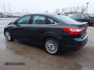 2014 Ford Focus Titanium with VIN 1FADP3J25EL310199, listed as a IAAI auction lot 40682901 with 84,885 mi miles and . Bid and sale history available at DreamBid. Image 3.