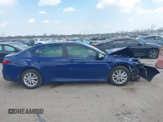 2025 Toyota Camry LE with VIN 4T1DAACK0SU091506, listed as a IAAI auction lot 41880460 with 8,407 mi miles and . Bid and sale history available at DreamBid. Image 13.