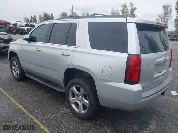 2015 Chevrolet Tahoe LT with VIN 1GNSCBKC5FR121069, listed as a IAAI auction lot 41799529 with 216,869 mi miles. Bid and sale history available at carsss.com. Image 3.