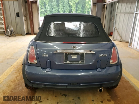 2005 MINI Convertible with VIN WMWRF33485TG10496, listed as a Copart auction lot 58582955 with 107,641 mi miles and Salvage title. Bid and sale history available at DreamBid. Image 6.