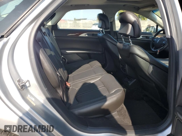 2014 Lincoln MKZ Hybrid z VIN 3LN6L2LU7ER821918, wystawiony jako Copart lot #60754555 z przebiegiem 128 295 mil mil oraz Szkoda całkowita • Salvage title. Historia ofert i sprzedaży dostępna na DreamBid. Obrazek 10.