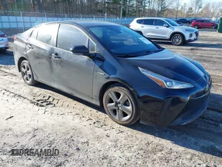 2019 Toyota Prius L Eco z VIN JTDKARFU9K3091887, wystawiony jako IAAI lot #41282017 z przebiegiem 240 000 mil mil oraz . Historia ofert i sprzedaży dostępna na DreamBid. Obrazek 1.
