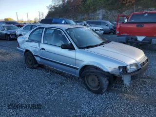 1997 Toyota Tercel CE z VIN JT2AC52L1V0227973, wystawiony jako Copart lot #77300554 z przebiegiem 301 799 mil mil oraz Szkoda całkowita • Salvage title. Historia ofert i sprzedaży dostępna na DreamBid. Obrazek 4.