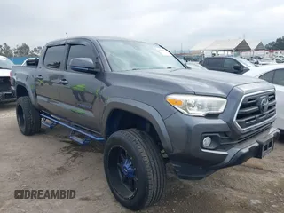 2018 Toyota Tacoma SR5 with VIN 5TFAZ5CNXJX066952, listed as a IAAI auction lot 41894562 with 141,818 mi miles and . Bid and sale history available at DreamBid. Image 1.