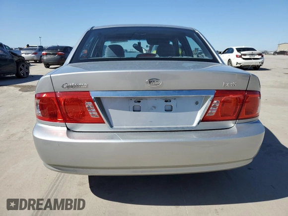 2005 Kia Optima LX z VIN KNAGD128055433689, wystawiony jako Copart lot #46909305 z przebiegiem 27 609 mil mil oraz Szkoda całkowita • Salvage title. Historia ofert i sprzedaży dostępna na DreamBid. Obrazek 6.