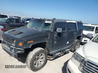 2003 Hummer H2 with VIN 5GRGN23U13H143781, listed as a Copart auction lot 77833264 with 0 mi miles and Salvage Title. Bid and sale history available at carsss.com. Image 1.