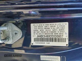 2002 Acura RSX Auto with VIN JH4DC548X2C030807, listed as a Copart auction lot 65178665 with 138,260 mi miles and Salvage title. Bid and sale history available at DreamBid. Image 12.