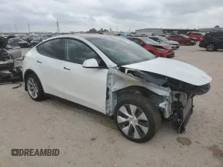 2023 Tesla Model Y Long Range z VIN 7SAYGDEE0PF802511, wystawiony jako Copart lot #54959415 z przebiegiem 12 902 mil mil oraz Szkoda całkowita • Salvage title. Historia ofert i sprzedaży dostępna na DreamBid. Obrazek 4.