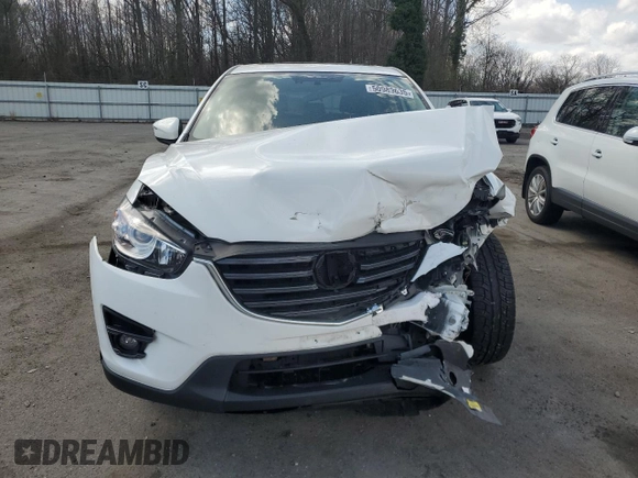 2016 Mazda CX-5 Grand Touring z VIN JM3KE2DY9G0645141, wystawiony jako Copart lot #50989635 z przebiegiem 123 898 mil mil oraz Szkoda całkowita • Salvage title. Historia ofert i sprzedaży dostępna na DreamBid. Obrazek 5.