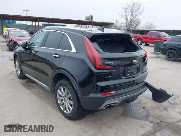 2020 Cadillac XT4 AWD Premium Luxury z VIN 1GYFZDR47LF122394, wystawiony jako IAAI lot #41703115 z przebiegiem 69 366 mil mil oraz . Historia ofert i sprzedaży dostępna na DreamBid. Obrazek 3.