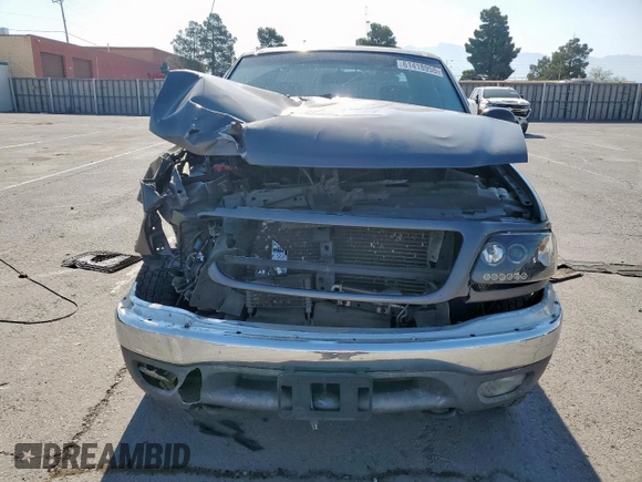 2002 Ford F-150 XL with VIN 1FTPX18L32NB65156, listed as a Copart auction lot 61418955 with 176,622 mi miles and Salvage title. Bid and sale history available at DreamBid. Image 5.