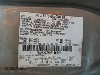 2006 Ford Taurus SE z VIN 1FAFP532X6A186042, wystawiony jako Copart lot #54409375 z przebiegiem 145 687 mil mil oraz Szkody całkowita. Historia ofert i sprzedaży dostępna na DreamBid. Obrazek 12.