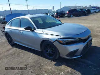 2023 Honda Civic Sport z VIN 2HGFE2F51PH558070, wystawiony jako IAAI lot #41854333 z przebiegiem 27 278 mil mil oraz . Historia ofert i sprzedaży dostępna na DreamBid. Obrazek 1.
