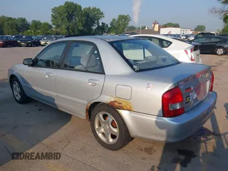1999 Mazda Protege ES z VIN JM1BJ2212X0194256, wystawiony jako IAAI lot #42452060 z przebiegiem 208 002 mil mil oraz . Historia ofert i sprzedaży dostępna na DreamBid. Obrazek 3.