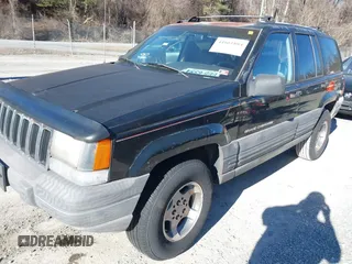 1996 Jeep Grand Cherokee Laredo with VIN 1J4GZ58S3TC345107, listed as a IAAI auction lot 41661884 with 179,175 mi miles. Bid and sale history available at carsss.com. Image 2.