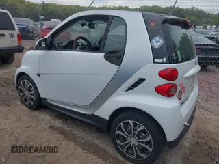 2014 Smart fortwo Pure with VIN WMEEJ3BA5EK749285, listed as a IAAI auction lot 42231893 with 119,507 mi miles and . Bid and sale history available at DreamBid. Image 3.