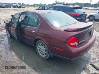 2001 Nissan Maxima SE with VIN JN1CA31D31T813090, listed as a IAAI auction lot 42389423 with 144,015 mi miles and . Bid and sale history available at DreamBid. Image 3.