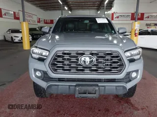 2021 Toyota Tacoma SR5 z VIN 3TMDZ5BN5MM114494, wystawiony jako IAAI lot #41723032 z przebiegiem 54 477 mil mil oraz . Historia ofert i sprzedaży dostępna na DreamBid. Obrazek 12.