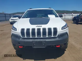 2014 Jeep Cherokee Trailhawk with VIN 1C4PJMBSXEW236807, listed as a IAAI auction lot 42660980 with 157,225 mi miles and . Bid and sale history available at DreamBid. Image 13.