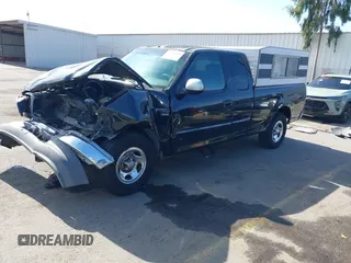 2002 Ford F-150 XL with VIN 1FTRX17L02NB79722, listed as a IAAI auction lot 41538404 with 202,050 mi miles. Bid and sale history available at carsss.com. Image 18.
