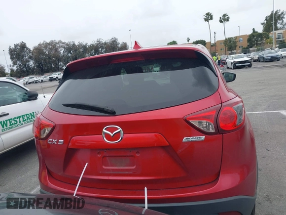 2016 Mazda CX-5 Touring with VIN JM3KE2CY3G0877185, listed as a IAAI auction lot 41729243 with 144,656 mi miles. Bid and sale history available at carsss.com. Image 16.