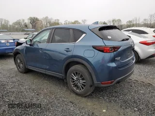 2017 Mazda CX-5 Touring with VIN JM3KFBCLXH0124451, listed as a Copart auction lot 51060275 with 126,807 mi miles and Salvage Title. Bid and sale history available at carsss.com. Image 2.