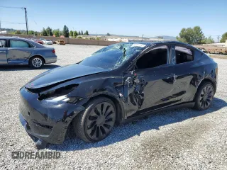 2022 Tesla Model Y Performance with VIN 7SAYGDEF0NF540933, listed as a Copart auction lot 56087145 with 59,717 mi miles and Salvage title. Bid and sale history available at DreamBid. Image 1.