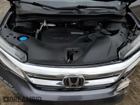 2020 Honda Pilot Touring 7-Passenger z VIN 5FNYF6H69LB005829, wystawiony jako Copart lot #52702555 z przebiegiem 90 746 mil mil oraz Szkoda całkowita • Salvage title. Historia ofert i sprzedaży dostępna na DreamBid. Obrazek 13.