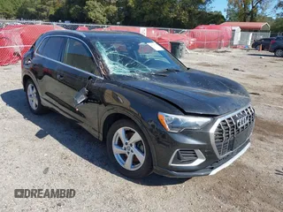 2020 Audi Q3 Premium with VIN WA1AECF39L1022788, listed as a IAAI auction lot 40698511 with 88,405 mi miles. Bid and sale history available at carsss.com. Image 1.