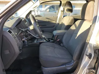 2010 Mazda Tribute Grand Touring with VIN 4F2CY0C74AKM03659, listed as a Copart auction lot 84494254 with 160,177 mi miles and Salvage Title. Bid and sale history available at carsss.com. Image 7.