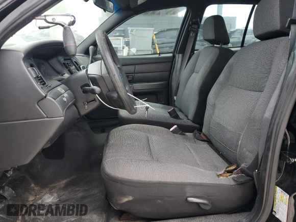 2009 Ford Police Interceptor z VIN 2FAHP71V69X143878, wystawiony jako Copart lot #53564285 z przebiegiem Nie podano mil oraz Szkoda całkowita • Salvage title. Historia ofert i sprzedaży dostępna na DreamBid. Obrazek 7.