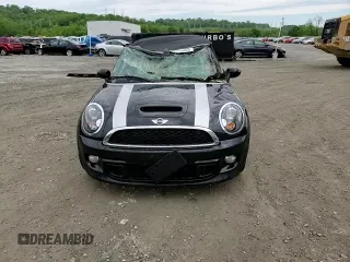 2013 MINI Convertible S with VIN WMWZP3C51DT297891, listed as a Copart auction lot 56745065 with 101,292 mi miles and Salvage title. Bid and sale history available at DreamBid. Image 14.