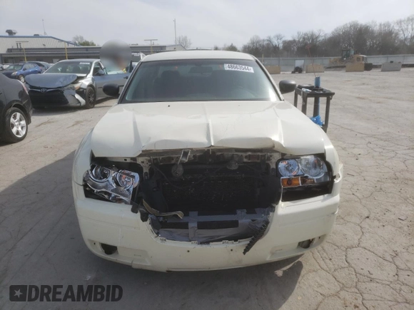 2005 Chrysler 300 with VIN 2C3JA43R25H663094, listed as a Copart auction lot 60813664 with 218,830 mi miles and Salvage Title. Bid and sale history available at carsss.com. Image 5.