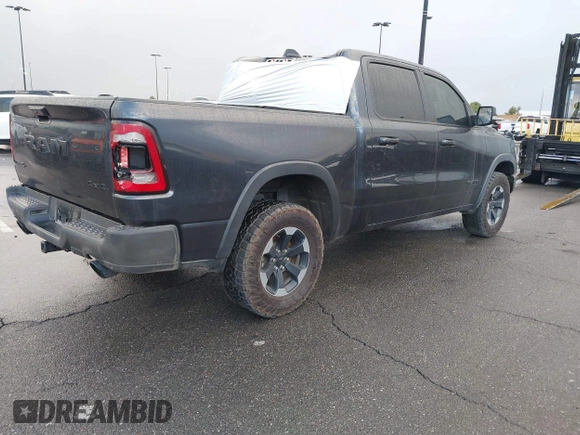 2019 Ram 1500 Rebel z VIN 1C6SRFLT2KN900600, wystawiony jako IAAI lot #41307832 z przebiegiem 74 481 mil mil oraz . Historia ofert i sprzedaży dostępna na DreamBid. Obrazek 4.