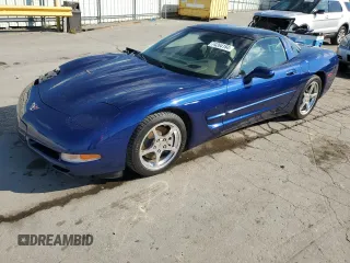 2004 Chevrolet Corvette with VIN 1G1YY22G145132963, listed as a Copart auction lot 74264184 with 74,077 mi miles and Salvage Title. Bid and sale history available at carsss.com. Image 1.