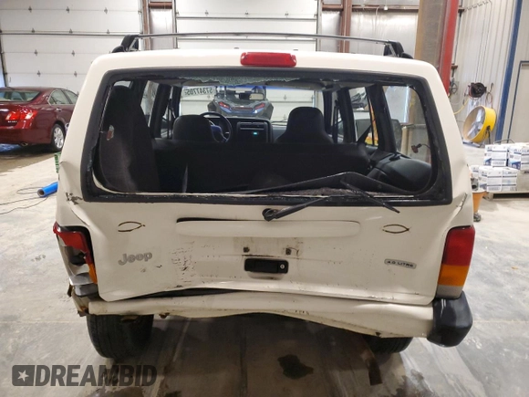 2000 Jeep Cherokee z VIN 1J4FF48S2YL104094, wystawiony jako Copart lot #57347705 z przebiegiem 75 948 mil mil oraz Nie do naprawy • Non repairable. Historia ofert i sprzedaży dostępna na DreamBid. Obrazek 6.
