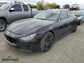 2015 Maserati Ghibli with VIN ZAM57XSA5F1149616, listed as a Copart auction lot 71738433 with 82,300 mi miles. Bid and sale history available at carsss.com. Image 1.