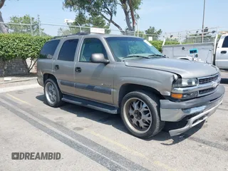 2002 Chevrolet Tahoe LS z VIN 1GNEC13Z22R173568, wystawiony jako IAAI lot #42477491 z przebiegiem 277 090 mil mil oraz . Historia ofert i sprzedaży dostępna na DreamBid. Obrazek 1.