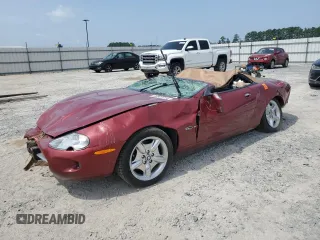 1999 Jaguar XK with VIN SAJGX204XXC038435, listed as a Copart auction lot 64843714 with Not Provided miles and Salvage Title. Bid and sale history available at DreamBid. Image 1.