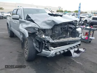 2021 Toyota Tacoma SR with VIN 3TMCZ5AN2MM405869, listed as a IAAI auction lot 42094533 with 78,449 mi miles and . Bid and sale history available at DreamBid. Image 6.