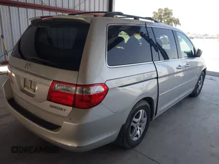 2005 Honda Odyssey EX-L with VIN 5FNRL38705B106488, listed as a IAAI auction lot 42545141 with 199,619 mi miles and . Bid and sale history available at DreamBid. Image 4.