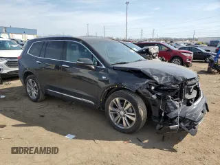 2023 Cadillac XT6 FWD Premium Luxury with VIN 1GYKPCRS4PZ103061, listed as a Copart auction lot 49300205 with 72,131 mi miles and Salvage title. Bid and sale history available at DreamBid. Image 4.